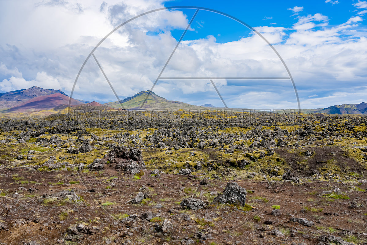 Icelandic volcanic landscape with lava field and colorful mountains