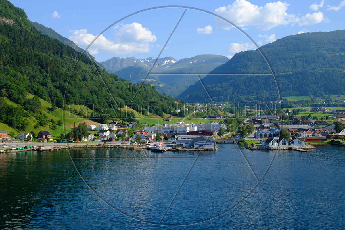 Norwegian village on a fjord surrounded by mountains